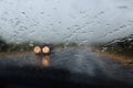 Drive car at heavy rain. Water drops at window Royalty Free Stock Photo