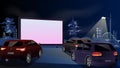 Drive-in cinema. Open-air cars are watching a movie on the movie screen. Open space auto theater. Night city with Royalty Free Stock Photo