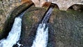 drive of the mill under bridge. water is filtered through sieve grid so that Royalty Free Stock Photo