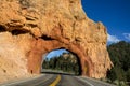 Drive-through red stone arch over highway in Red Rock Canyon Utah Royalty Free Stock Photo