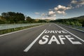 Drive safe message on Asphalt highway road through the countryside Royalty Free Stock Photo