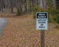 Drive Slowly, Watch For Children and Animals Sign at Ratcliff Lake Recreation Area, Ratcliff, Texas Royalty Free Stock Photo