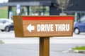 Drive Thru sign near a fast food restaurant showind the direction for cars Royalty Free Stock Photo