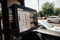 drive-thru window with mobile ordering option, displaying menu and payment options