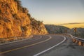 Drive up a winding road along rocky cliffs at sunset in Mount Lemmon Arizona Royalty Free Stock Photo