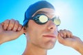 Driven to sporting excellence. Cropped portrait of a handsome male swimmer getting ready to compete. Royalty Free Stock Photo
