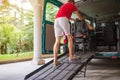 Disabled person on wheelchair using van ramp Royalty Free Stock Photo