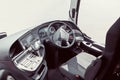 driver cab of a bus with a steering wheel and various devices and gadgets Royalty Free Stock Photo