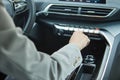 The driver controls the air conditioning in a modern electric car