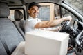 Driver delivering goods by vehicle Royalty Free Stock Photo