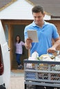 Driver Delivering Online Grocery Order To House Using Digital Ta Royalty Free Stock Photo