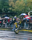 Driver doing stunt on the motorbike with crowd in the barckround Royalty Free Stock Photo