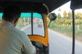 The driver is a fat tuk in Hampi. A look from the passenger side