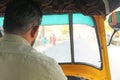 The driver is a fat tuk in Hampi. A look from the passenger side