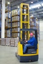 The driver of a forklift pallet truck, reach trucks. Royalty Free Stock Photo