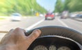 The driver hand on the steering wheel of a car Royalty Free Stock Photo