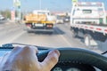 Driver hand on the steering wheel inside the car during a traffic jam Royalty Free Stock Photo