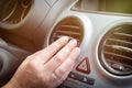 Driver hand tuning air ventilation grille Royalty Free Stock Photo