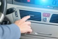Driver hand tuning air ventilation grille Royalty Free Stock Photo