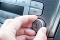 Driver hand tuning temperature control knob in car air conditioning system close up, comfort and fresh air in vehicle cabin Royalty Free Stock Photo