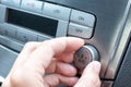 Driver hand tuning temperature control knob in car air conditioning system close up, comfort and fresh air in vehicle cabin Royalty Free Stock Photo