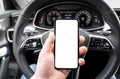 Driver hand using smartphone in car. Smartphone in a car use for Navigate or GPS. Mobile phone with  white screen. Blank Royalty Free Stock Photo