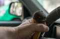 Driver keeps ice cream behind the wheel of the car