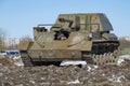 A driver looks out of the hatch of the old soviet self-propelled artillery mount SU-76