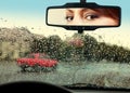 Driver looks to rearview mirror Royalty Free Stock Photo