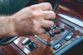 Driver man hand holding automatic transmission in car. Male hand changing levels of automatic gearbox in the car Royalty Free Stock Photo