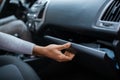 Driver Opening Glovebox Compartment Royalty Free Stock Photo