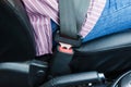 driver in passenger compartment with fastened seat belt. Closeup of fixed seat belt buckle Royalty Free Stock Photo