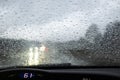 Driver point of view inside a car while driving on a rainy day Royalty Free Stock Photo