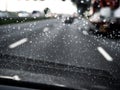 Driver POV of car driving on rainy highway Royalty Free Stock Photo