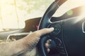 Driver pressing volume button on steering wheel Royalty Free Stock Photo