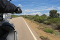 Driver riding motorcycle on an asphalt road Royalty Free Stock Photo