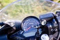 Driver riding motorcycle on an asphalt road in a tropics Royalty Free Stock Photo