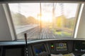 Driver`s cab of aspeed passenger train, view of the railway with the effect of speed motion blur. Royalty Free Stock Photo