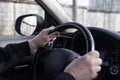 The driver`s hands are on the steering wheel Royalty Free Stock Photo