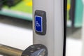 Driver's signal button supplemented with Braille on the city bus. Infrastructure for the visually impaired and disabled Royalty Free Stock Photo