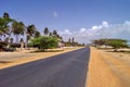 Driver\'s view of coastal highway leading to Palm Beach in the island of Aruba. Royalty Free Stock Photo