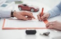 Driver signing a car insurance Royalty Free Stock Photo