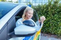 Driver sutdent girl showing the key Royalty Free Stock Photo