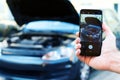 Driver take photo of car with engine