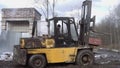 Driver tryes to ride forklift stucked in deep mud