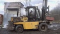 Driver tryes to ride forklift stucked in deep dirt