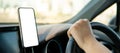 Driver using mobile app for GPS navigation Royalty Free Stock Photo