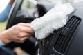 Close up of man hand cleaning car interior with dust cleaner Royalty Free Stock Photo