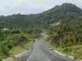 Scenery view on the up-down and winding road on the hills Royalty Free Stock Photo