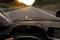 Driver view to road blurred from car speed motion. Drivers POV from inside a car to empty road landscape. Royalty Free Stock Photo